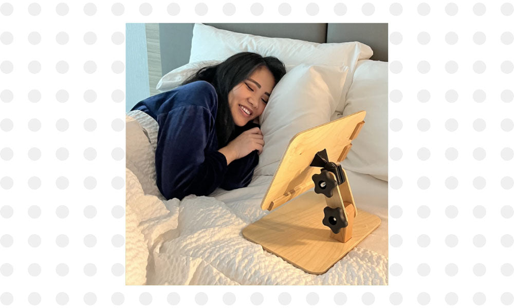 Girl in bed using Perfekt Holder